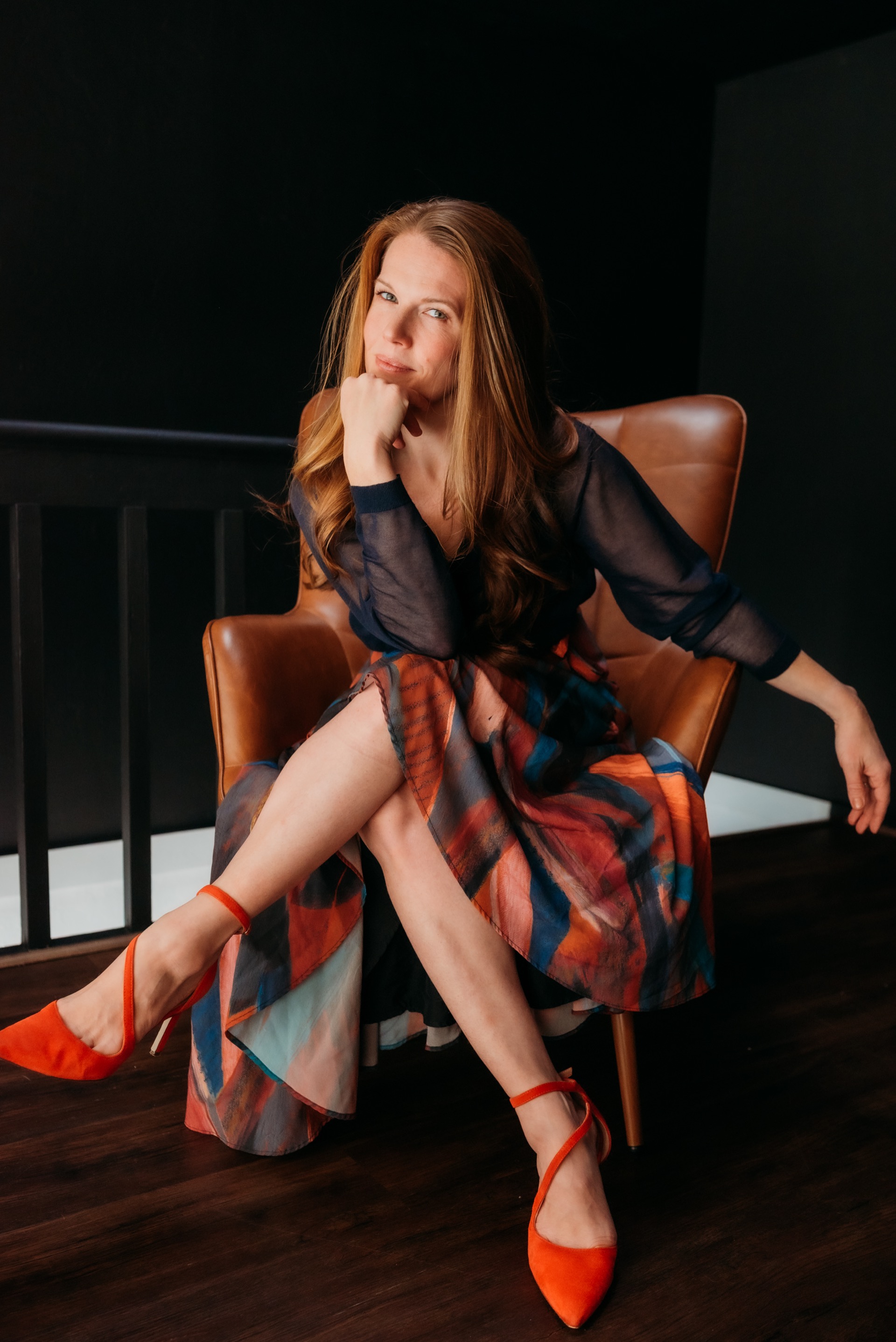 Danielle seated in a leather chair