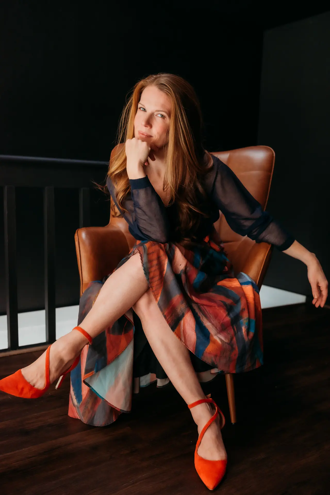 Danielle seated in a leather chair