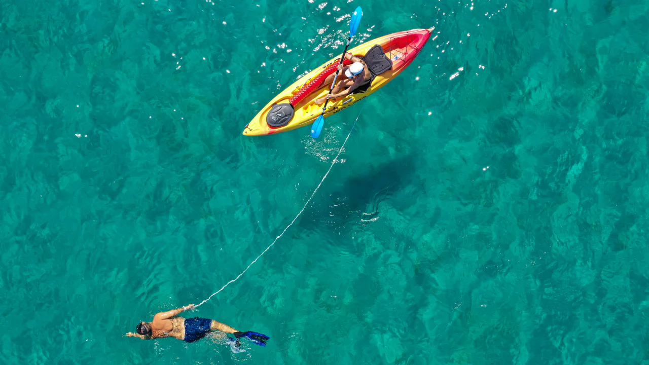 Kayak with swimmer — supporting a partner through their grief