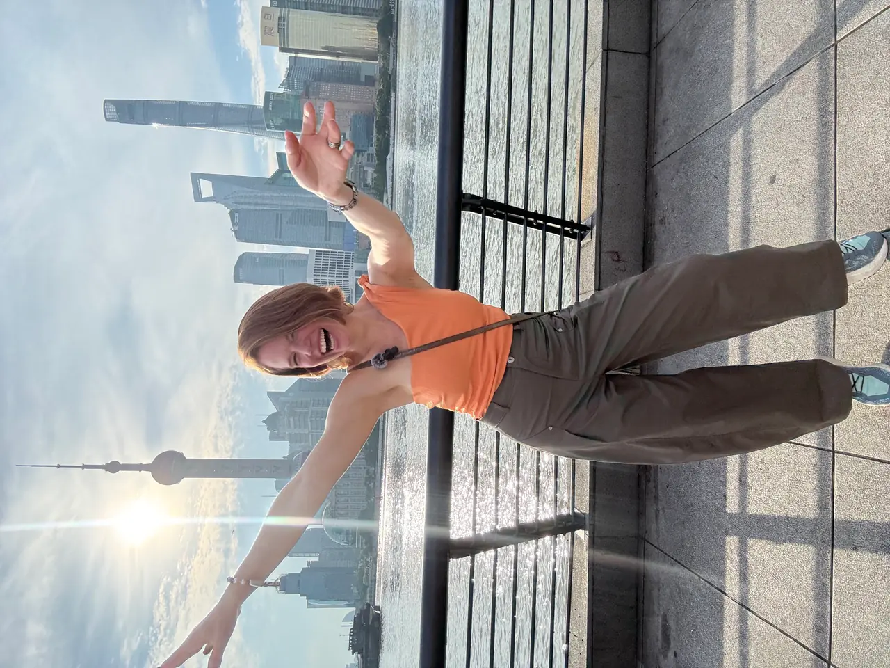 Danielle on the Bund with the Pudong skyline behind her.