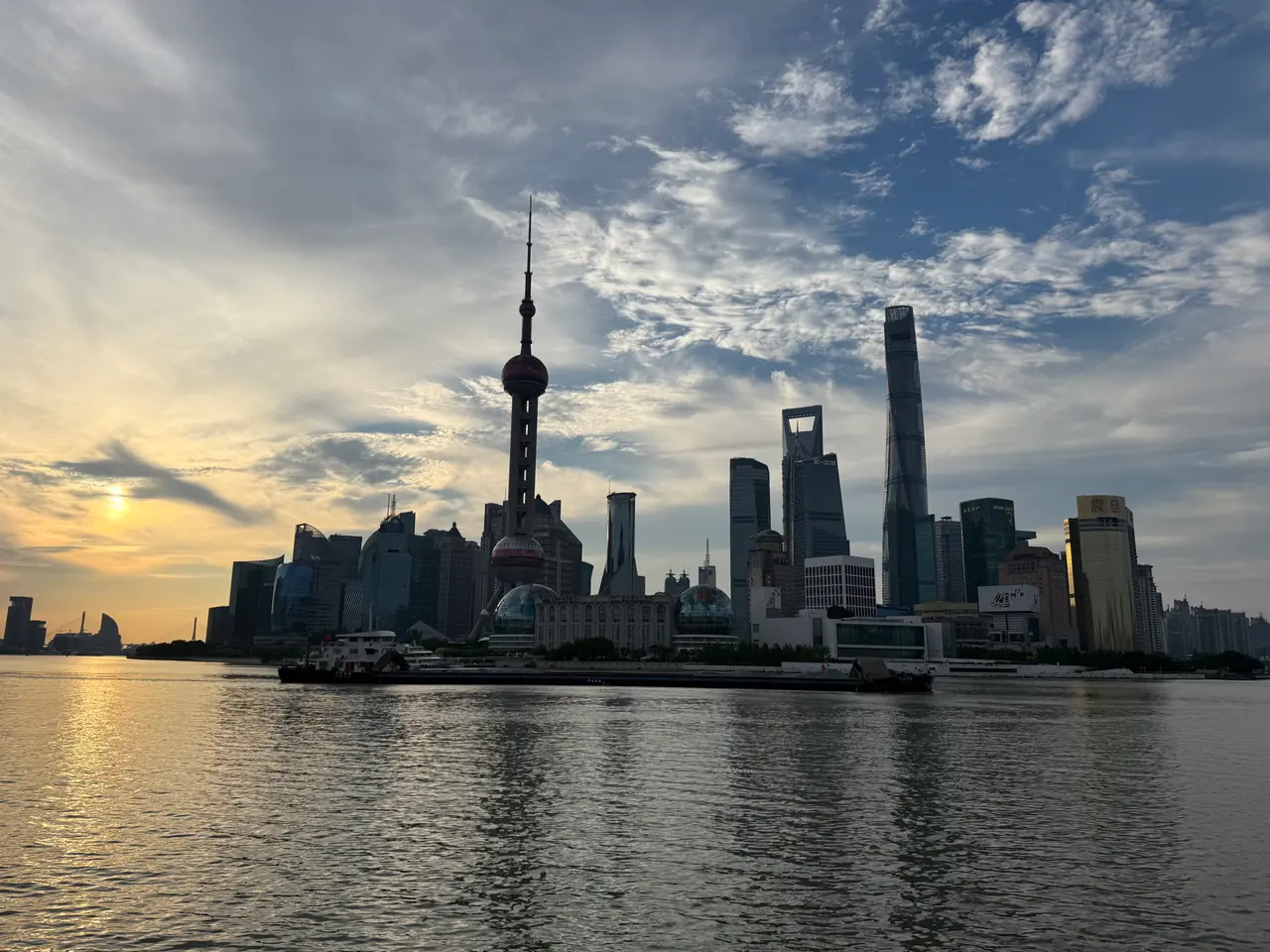 The Shanghai skyline across the river in early morning light.